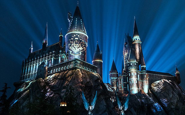 Hogwarts illuminated at night white lights
