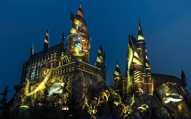 Hogwarts illuminated at night yellow Hufflepuff lights