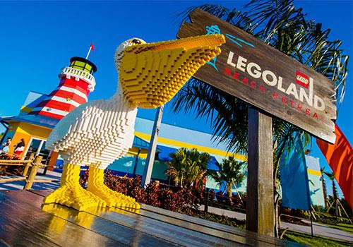 Pelican made of legos next to the Legoland sign