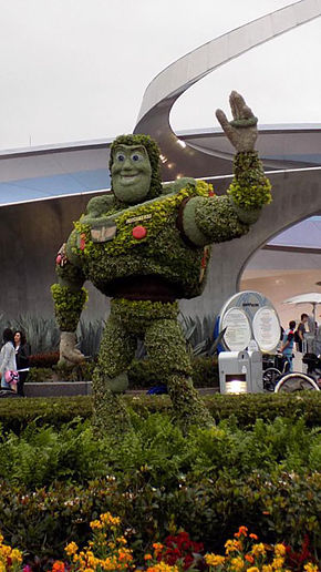 bushes and flowers in a replica of the Buzz Lightyear character from Toy Story