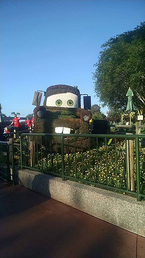 bushes and flowers in a replica of the Mater character from Cars