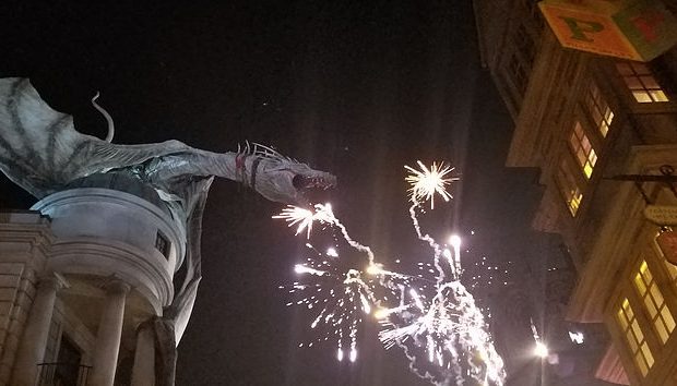 fireworks by statue of Gringott's dragon