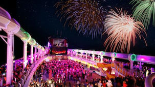 fireworks visible from the deck of a DCL ship during a deck party