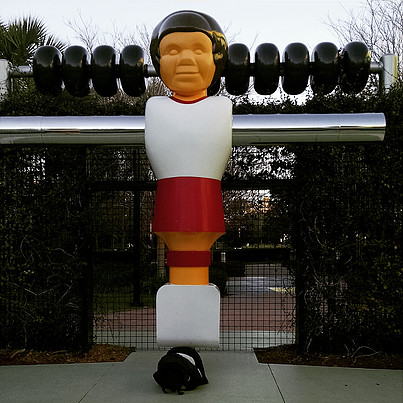 giant sculpture of foosball player figure