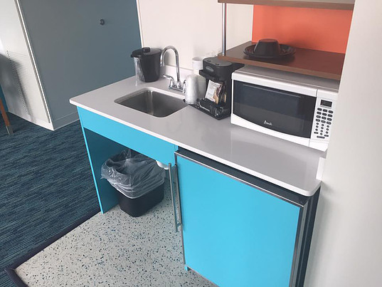 kitchenette with fridge and microwave at Cabana Bay