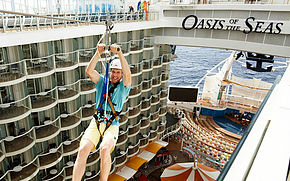 man zip-lining across deck on Oasis of the Seas