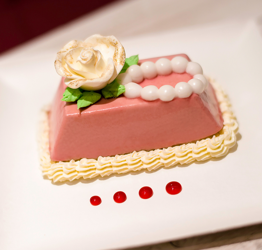 raspberry mousse with icing rose and fondant pearls