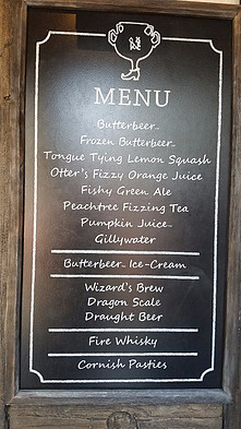 sign with menu of soft drinks for sale