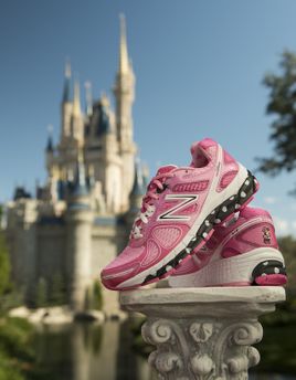 sneakers on pedestal in front of Disney castle
