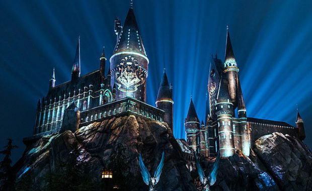 view of Hogwarts castle illuminated at night