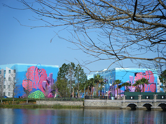 view of colorfully painted building by the water