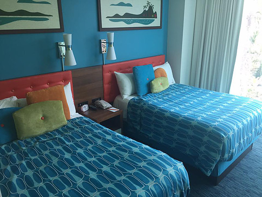 view of two double beds with throw pillows at Cabana Bay suite