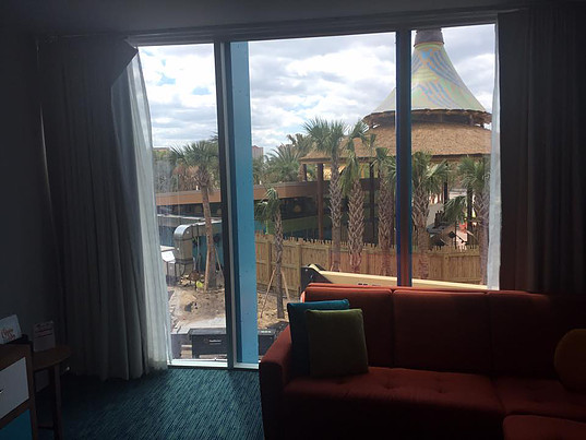 view out window of Cabana Bay suite of outdoor patio and cabana
