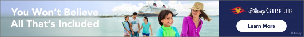 family in front of Disney Cruise ship at beach